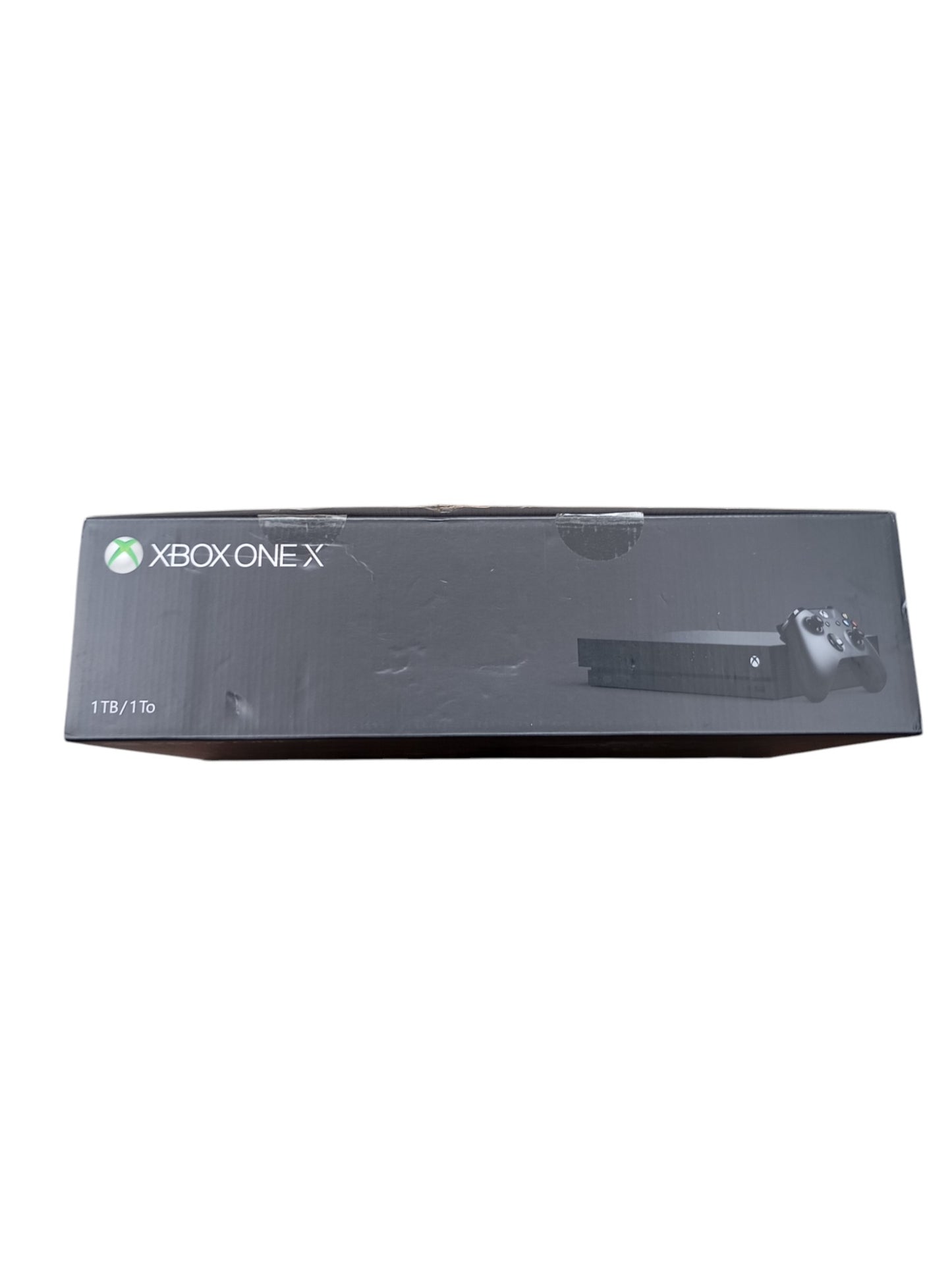 Console Xbox One X en boîte