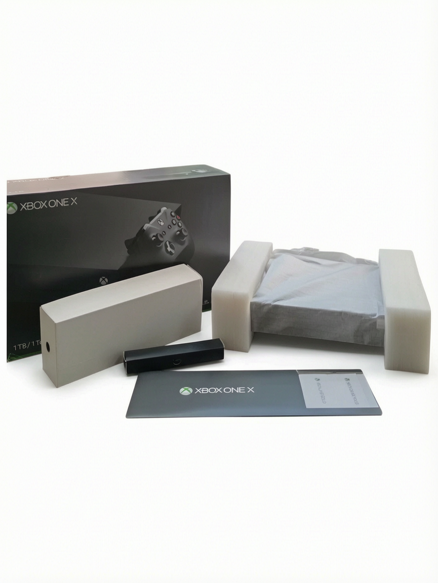 Console Xbox One X en boîte